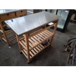 Wooden framed unit with stainless steel top