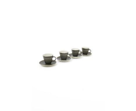 ‡ Lucie Rie DBE (1902-1995) and Hans Coper (1921-1981) a set of four tea cups and saucers, the cups with incised sgraffito li