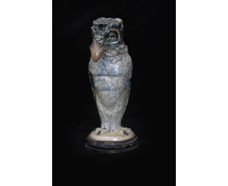 A Martin Brothers stoneware bird jar and cover by Robert Wallace Martin, dated 1905, modelled with open stare, small hooked b