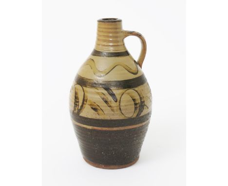 ‡ Michael Cardew CBE (1901-1983) a Winchcombe Pottery earthenware flagon,  simple painted decoration in tan and brown, glazed