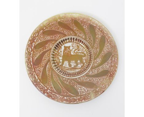 A William De Morgan Pottery charger, on John Heath Davis blank, painted to the well with a lioness alert, her front paw raise