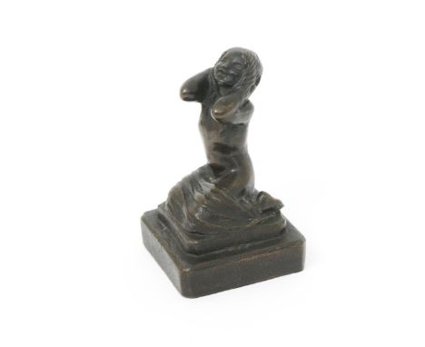 A patinated bronze figure of a young woman cast from a model by Phoebe Stabler, modelled kneeling with a towel resting on her