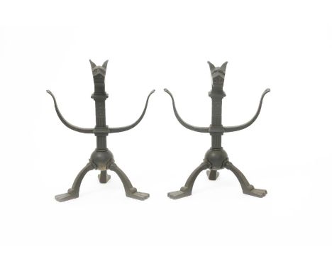 A pair of cast iron firedogs, in the manner of Richard Norman Shaw, based on a thirteenth century design,  spherical ball on 