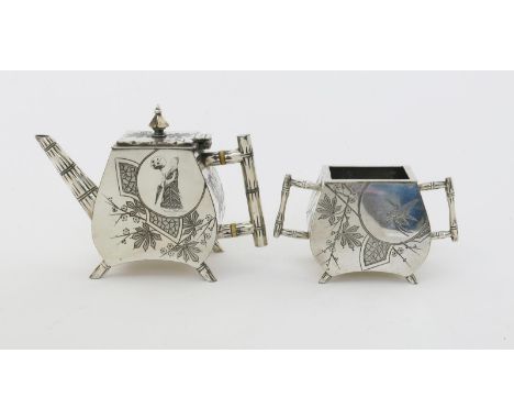 λ An Aesthetic Movement electroplated metal teapot and sugar basin, with ivory insulators, cast bamboo handle and spout, with