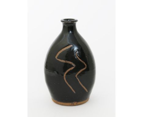 Shigeyoshi Ichino (1942-2011) a Leach Pottery stoneware bottle vase, covered in a rich tenmoku glaze, resist decorated with s