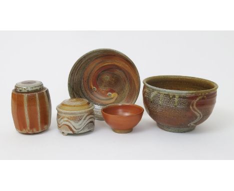 Micki Schloessingk (born 1949) a salt-glazed stoneware tea caddy and cover, cut sided form, a footed bowl, another smaller, a