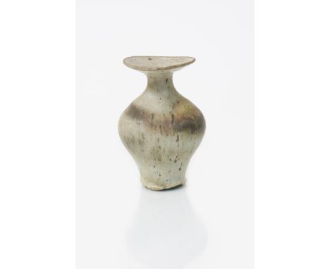 ‡ Dame Lucie Rie DBE (1902-1995) a stoneware vase, swollen form with flaring neck, covered to the foot with a streaked matt m