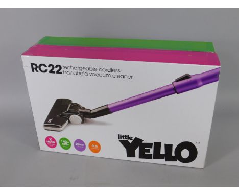 A Little Yello hand held vacuum cleaner, model RC22, in original box.