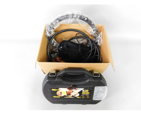 An Exakt hand held precision saw, model no EC320, in fitted case, together with various accessories, (1 box).