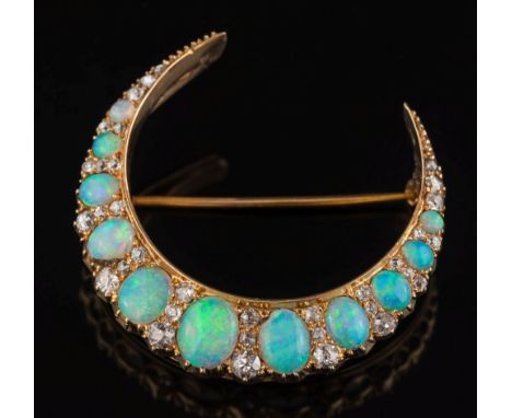 A 20th century gold, opal and diamond crescent brooch: with eleven graduated opals separated by pairs of graduated old, brill