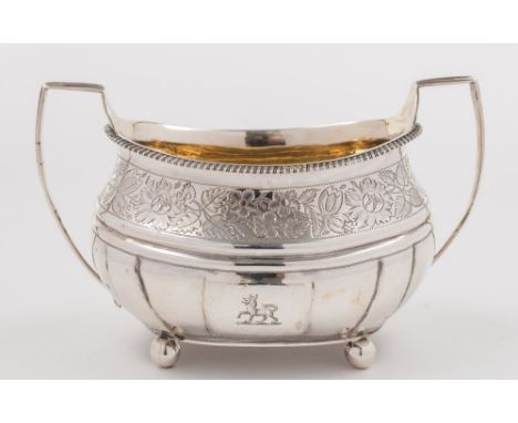 A George III silver sugar basin, maker Thomas Wallis II & Jonathan Hayne, London, 1810: crested, of barge-shaped outline with