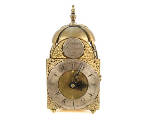 Richard Peckover, London, a miniature lantern clock: the three and a half inch break-arch brass dial having a raised silvered