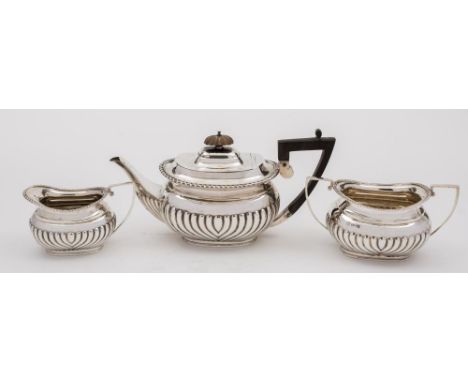 A Victorian matched three-piece silver bachelor's tea service, various makers and dates:  with half-reeded decoration, total 