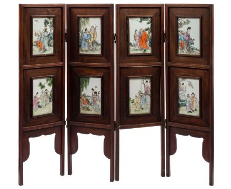 A Chinese 'Eight Immortals' famille rose four-fold screen: each panel painted with an immortal and attendants in a landscape 