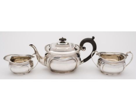 A George V silver three-piece tea service, maker George Howson, Sheffield, 1913/16: of barge-shaped outline with reeded borde