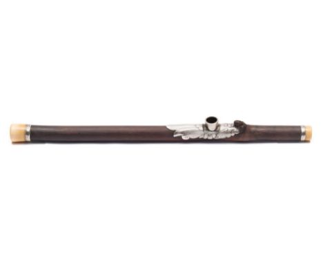 An early 19th century bamboo, ivory and white metal opium pipe: the mount decorated with a butterfly amongst flowers,54.5cm. 