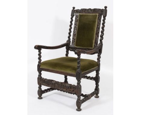 A 17th Century carved walnut and beechwood open armchair:, the upholstered panel back with shell, foliate, flowerhead and hus