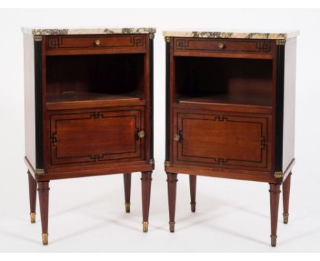 A pair of French mahogany and inlaid bedside cabinets:, decorated with ebonised lines, each surmounted by a panel of pink var