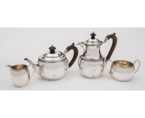 A George V silver four-piece tea service, maker Elkington & Co, Birmingham, 1912: of plain circular form with reeded borders,