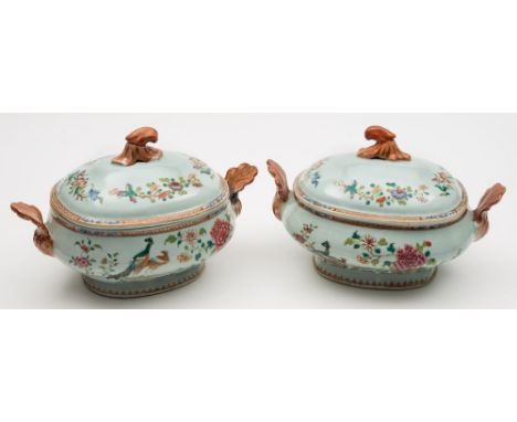 A pair of Chinese famille rose 'double-peacock' pattern tureens and covers: with rococo scroll handles and finials, painted w