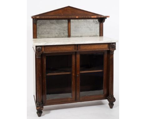 A late Regency rosewood chiffonier:, the shelved and mirrored superstructure with angled arch back and anthemion scroll suppo