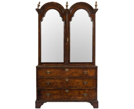 An 18th Century walnut and crossbanded double dome cabinet on chest:, adapted as a wardrobe, the upper part with triple gilt 