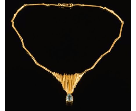 A pear-shaped aquamarine  single-stone necklace: the aquamarine approximately 13mm x 9mm in a rub-over setting, below a  text