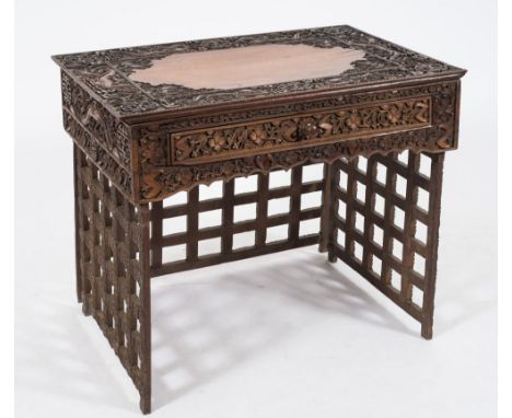 A Chinese carved wood 'Campaign' desk:, the rectangular top with plain centre, dragon and bamboo spandrels and a wide surroun