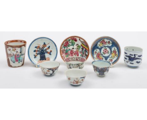 A Chinese Batavia famille rose beaker and a group of Chinese and Japanese teabowls and saucers: the beaker painted with shape