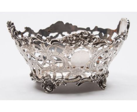 An Edward VII silver bon-bon basket, maker C S Harris & Sons Ltd, London, 1908: of oval outline, with foliate and scroll pier