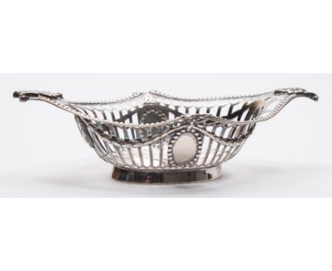 An Edward VII silver basket, maker William Hutton & Sons, London, 1901: of oval outline with pierced decoration and beaded bo