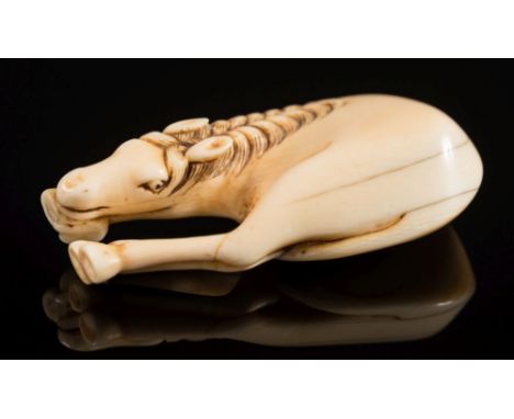 A Japanese carved ivory netsuke of a grazing horse: unsigned, Edo period, 6cm. long, with hairline cracks.l