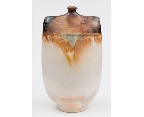 John Bedding [b.1947]. A large studio pottery bottle: of flattened ovoid form  decorated with mottled brown and green glazes,