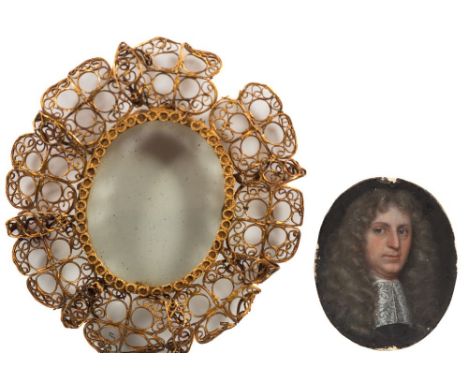 English School 17th Century-A miniature portrait of a gentleman:, head and shoulderswith powdered wig, blue eyes and a lace j