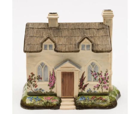 A Flight, Barr & Barr (Worcester) pastille burner or night light holder and stand: in the form of a rustic cottage with thatc