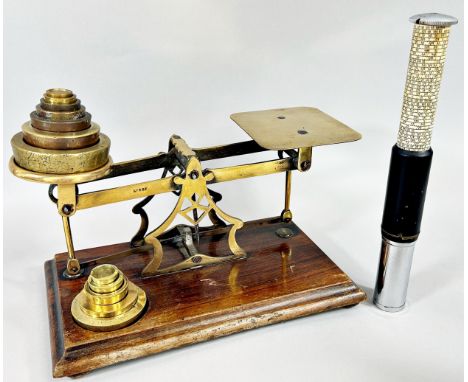 A set of Avery postal scale with weights, together with seven further Avery brass weights and an Otis King’s Pocket Calculato