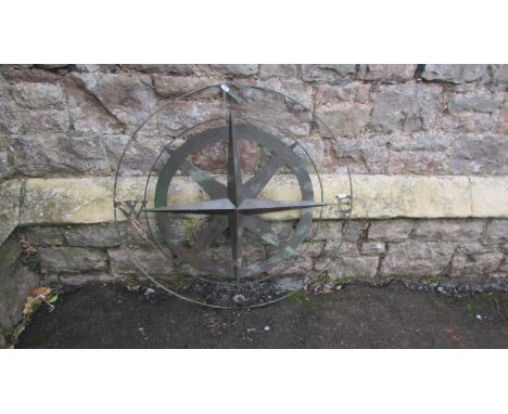 A contemporary copper verdigris radiating star compass, 80cm diameter