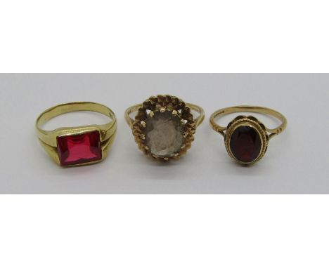 Three vintage gem set gold rings; a 10k scissor-cut synthetic ruby example, size R, and two 9ct examples, 12.2g total