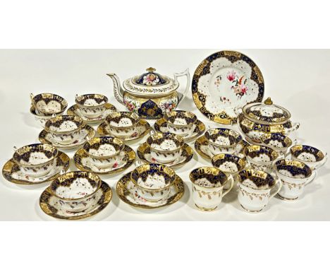 Mid 19th century Coalport tea service with hand painted floral panels within blue and gilt borders comprising teapot, sugar b