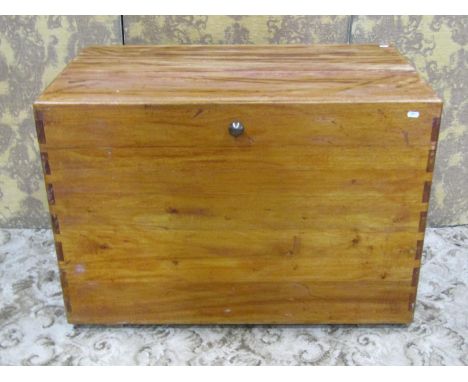 A Camphor wood trunk with hinged lid and exposed dovetail construction, 66cm high x 95xm x 56cm