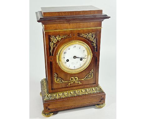 A French walnut cased mantle clock with gilt metal mounts, the white enamel dial marked ‘Blanc Fils, Paris Royal, 32cm high (
