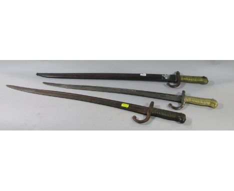 Three dated French Chassepot bayonets, one with scabbard dated 1870, 1874, 1874, together with two French M1874 bayonets 1908