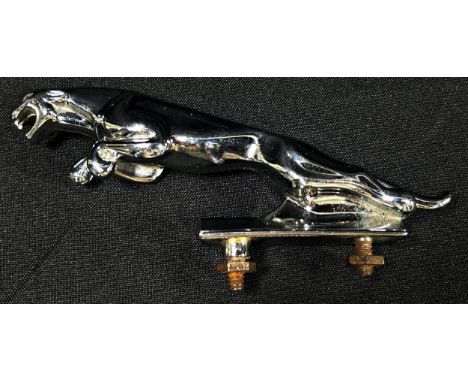 A vintage chromium Jaguar automobile bonnet mascot, 12cm, marked to underside, numbered 724265, together with a quantity of v