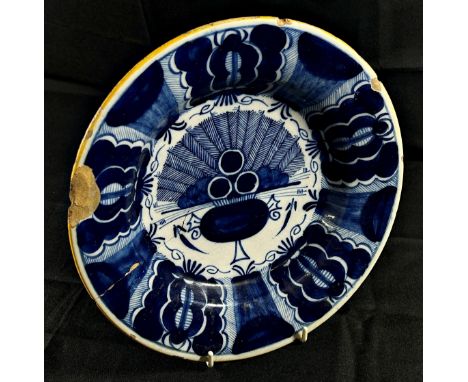 An 18th century Delft plate, marked to underside, 24cm diameter, together with a small 19th century octagonal plate, with tra