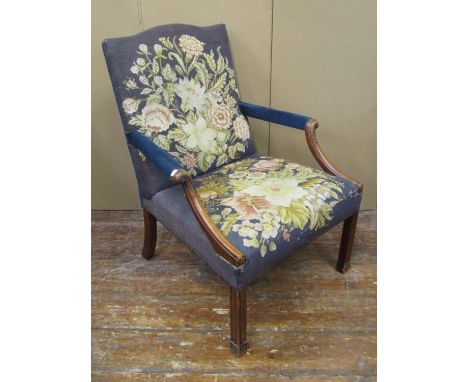 A pair of Gainsborough style open arm chairs with carved detail and hand worked tapestry seats and backs attributed to Rupert