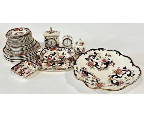A large quantity of ironstone china to include lamps, vases, a mantle clock, dinner wars etc.