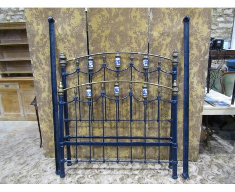 A Victorian painted brass and iron 4ft 6 double bedstead with blue and white transfer printed detail 