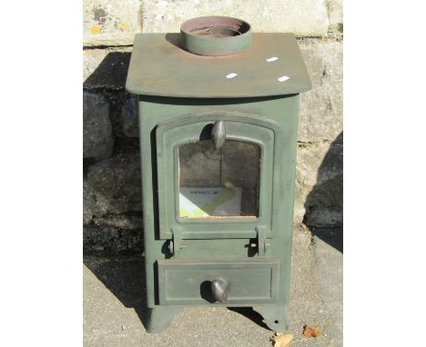 A small Villager cast iron multi fuel stove with arched glazed panelled drop door, 59cm high x 34cm x 35cm