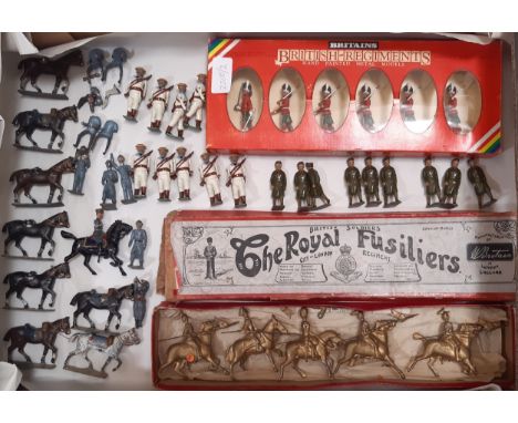 A collection of vintage lead soldier figures including Britains box set 7245 Gordon Highlanders, 5 unpainted lancers in a Roy