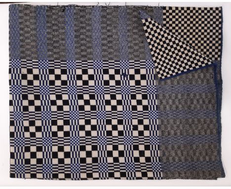 Welsh woollen blanket in reversible double weave, woven on a narrow loom in 2 sections joined with centre seam. In blue, blac